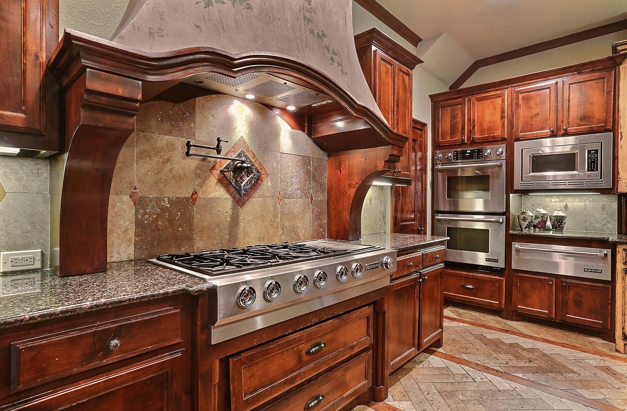 A fabricator checking the fit of a stone countertop against base cabinets
